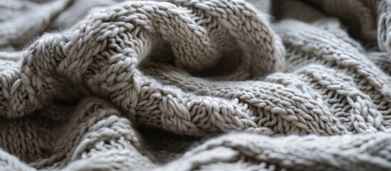 Poster - Knitted product made of woolen yarn with a clear pattern in pleasant colors Texture of a knitted blanket. Creative Banner. Copyspace image