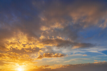 Glowing real sky at sunset texture background overlay. Dramatic red and orange clouds.