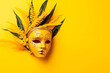 Venetia yellow mask with feathers on a yellow background. mardi gras background. Carnival Party. Masquerade Concept.