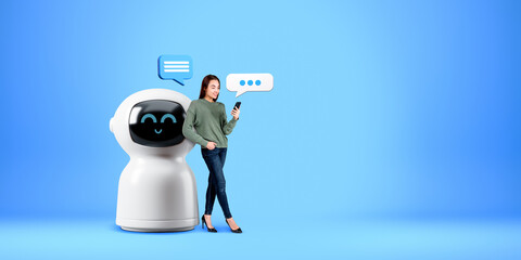 Poster - Woman with smartphone, standing near robot on copy space empty background