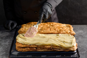 Wall Mural - Process making a Napoleon cake with poppy seeds and cherries. Close up