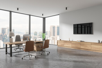 Poster - Corner view of office interior with work desk near window, pc desktop and drawer