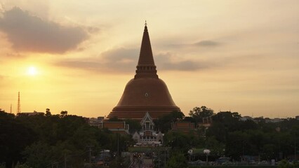 Wall Mural - Golden pagoda of Phra Pathom Chedi with sunset sky in downtown