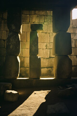 Fototapete - The play of shadows and light on ancient stone structures, creating a mysterious aura.