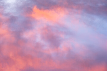 Wall Mural - Colorful sunset sky in purples, pinks, oranges, and blues, beautiful cloudscape background