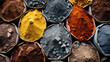 Various earth pigments in shades of yellow, orange, gray, and brown presented in bowls, used for natural dyes and paints.