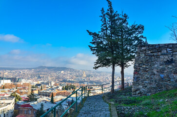 Wall Mural - walk with panoramic city view near Narikala fortress in Tbilisi, Georgia 