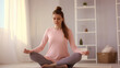© yanapopovaiv - pregnant woman meditates, sits on the floor with her eyes closed
