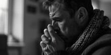 A Man In A Scarf Is Shown In Prayer. This Image Can Be Used To Depict Spirituality And Devotion