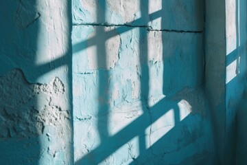 Poster - A shadow of a window cast on a blue wall. Can be used to depict interior design, architecture, or concepts of light and shadow