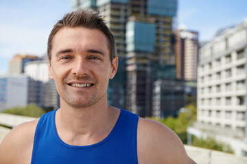 Poster - Happy man, portrait and fitness in city for workout, exercise or outdoor training in Cape Town. Face of young male person or athlete smile for run, cardio or health and wellness in an urban town