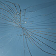 © Milou Dirks - abstract background with broken mirror glass crack reflecting the blue sky