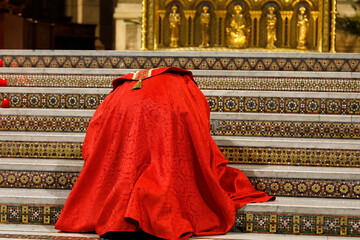 Wall Mural - Priest prosternating in the Sacred Heart basilica, Paris, France