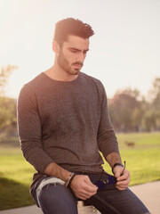 Wall Mural - Attractive young man portrait in city