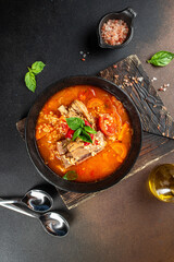 Wall Mural - bulgur soup with tomatoes and ribs in bowl. Restaurant menu, dieting, cookbook recipe top view