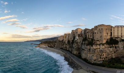 Wall Mural - view of Rotonda Beach and the colourful old town of Tropea in Calabria at sunset