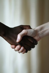 Aufkleber - Two people shaking hands in close proximity. This image can be used to depict collaboration, partnership, or agreement in various business contexts