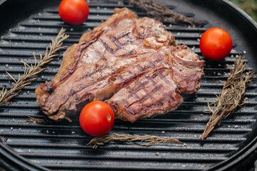 Canvas Print - Dry Aged Barbecue Porterhouse Steak T-bone beef steak sliced with large fillet piece with herbs and salt. American meat restaurant