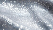 Silver glitter fabric, shiny silver fabric with sequin,  sparkly fabric background with bokeh light, luxury fabric, close-up shot of waves of fabric