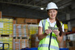 © offsuperphoto - factory worker counting money in the warehouse storage