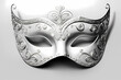 Mysterious gold and white Venetian mask in indoor carnival celebration, Mardi Gras mask on white background