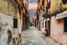 Quaint Street In Historic Venice, Italy With Pizzeria Sign