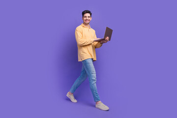 Wall Mural - Full size photo of attractive man instagram twitter facebook telegram dressed stylish yellow clothes isolated on purple color background