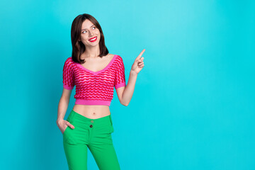 Wall Mural - Photo of optimistic woman with straight hairdo dressed knitwear top look directing at sale empty space isolated on blue color background