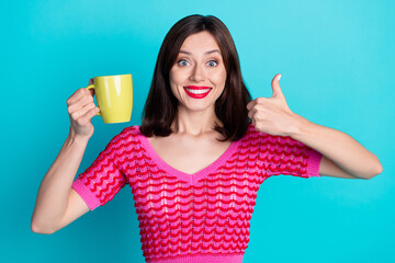 Wall Mural - Photo of positive girl hold cacao mug make fine gesture enjoying aroma isolated over blue color background