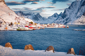Wall Mural - dramatic winter sunrise on gravdal bay. cold morning scene of popular tourist destination - lofoten 