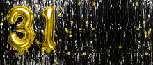 Gold Foil Balloon Number Number 31 On A Background Of Black Tinsel Decoration. Birthday Greeting Card, Inscription Thirty One. Anniversary Event. Banner.