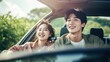 © Paniti - Joyful Asian couple on a road trip, smiling and enjoying their journey together in a car, symbolizing happiness, travel, and shared experiences