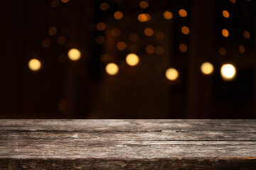 Poster - image of a wooden table on a blurred bokeh background