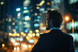 © Andrii  - City Dreams: Ambitious Businessman Overlooking Night Skyline