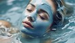 Woman having a Mud Bath with Facial Mask in Wellness Resort or Spa - Relaxation, Skin Care and Mental Recovery 
