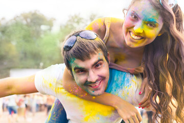 Happy couple in love on holi color festival