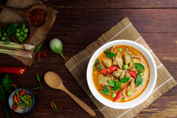 Canvas Print - Chicken green curry Asian food, Beef green curry Thai food on a soup bowl with a mixture of herbs, vegetables and Thai red chilli spices. Top view.