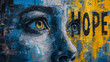 The face of a woman painted in yellow and blue on an old wall