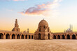 Minaret and ablution fountain of the Ibn Tulun Mosque, sunset view of a famous place of Cairo, Egypt