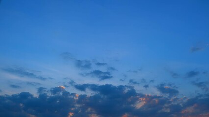 Wall Mural - Time-lapse magic revealed the sun's descent in a sky adorned with fast-moving clouds. The palette shifted from warm yellows to cool blues, creating a breathtaking spectacle above. Timelapse.
