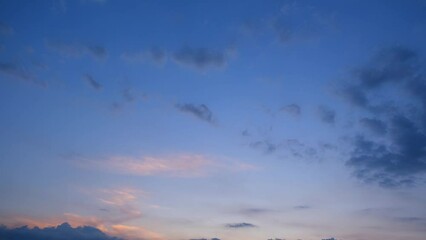 Wall Mural - A mesmerizing time-lapse of sunrise unveils the sky's quick-changing beauty, with clouds morphing and swirling as the sun bursts forth in a blaze of golden light. Timelapse.
