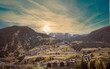 View of mountains valley. Pyrenees. Cityscape with sunset sky. View of Canillo city from Roc Del Quer viewpoint, Andorra, Europe