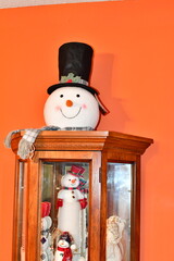 Poster - Snowman Decoration on a Wooden Cabinet