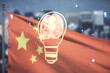 Abstract virtual idea concept with light bulb and human brain illustration on Chinese flag and city background. Neural networks and machine learning concept. Multiexposure