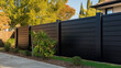 © PaulShlykov - Modern metal fence for fencing the yard area. Horizontal sections of the fence made of metal