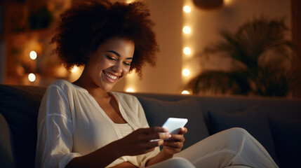 Sticker - Happy young woman using a smartphone while comfortably seated on a couch