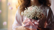 Close up of beautiful flower bouquet on woman's hand. A Gift and a gift box for woman. Luxury Flower Bouquet