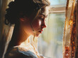 young woman engrossed in knitting, afternoon sunlight through a window