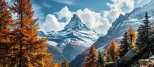 View On Autumn Forest Snowy Matterhorn Mountains And Blue Sky With White Clouds Switzerland. Creative Banner. Copyspace Image