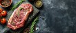 Ribeye fresh raw beef steak with spices on stone board Top view flat lay with copy space. Creative Banner. Copyspace image